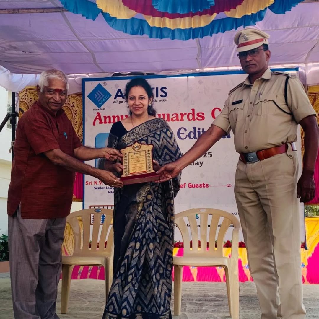 An Elegancia representative receiving an award at a community event