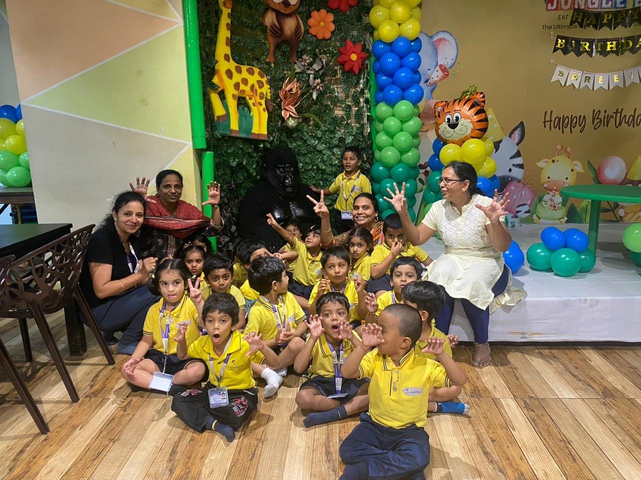 Elegancia students and teachers sharing a playful school outing