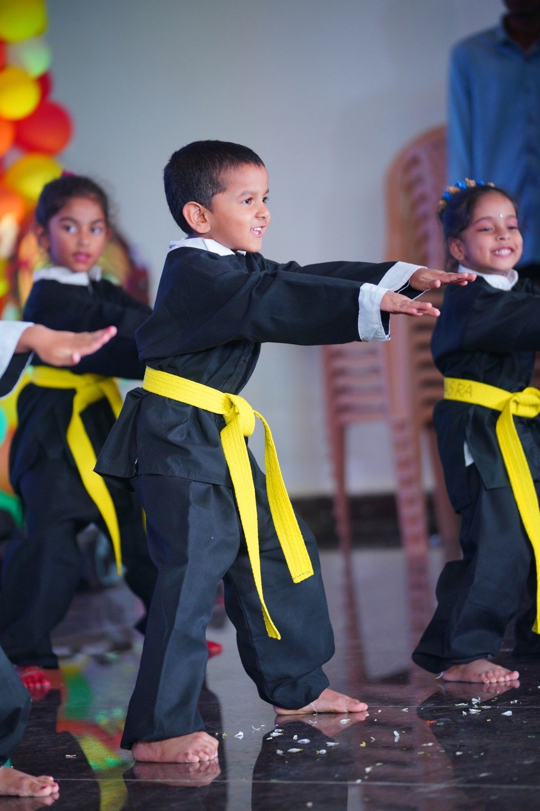 A student demonstrating karate during a school performance